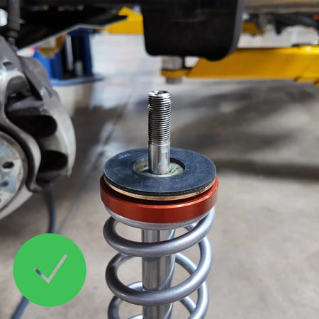Strut washer installation